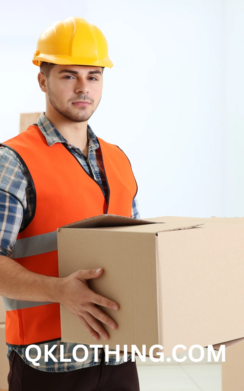 Finished custom apparel being carefully folded and placed into eco-friendly packaging for global logistics and shipping.